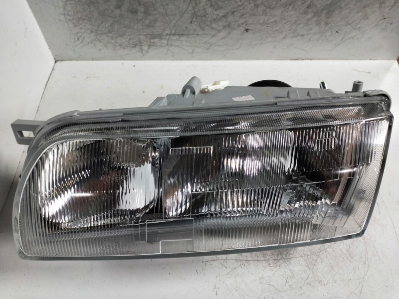 Recambio de faro izquierdo para nissan primera berl./familiar (p10/w10) referencia OEM IAM    Recambio de faro izquierdo para nissan primera berl./familiar (p10/w10) referencia OEM IAM