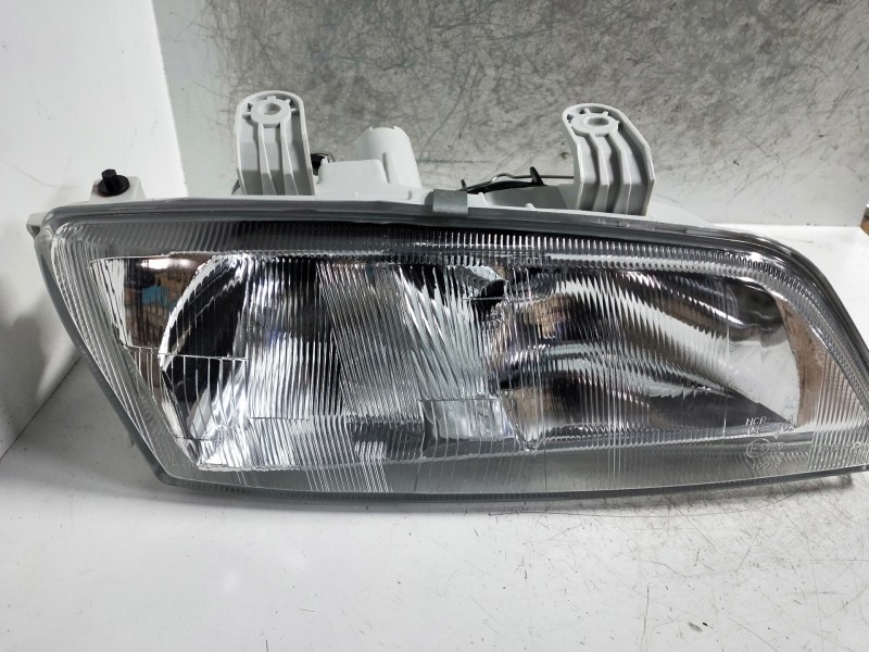 Recambio de faro derecho para nissan primera berlina (p11) referencia OEM IAM   