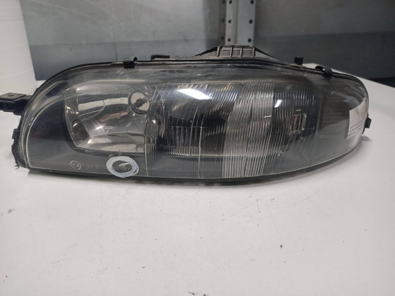 Recambio de faro izquierdo para fiat marea weekend (185) 1.9 jtd 110 st. moritz (i) referencia OEM IAM 88201557  