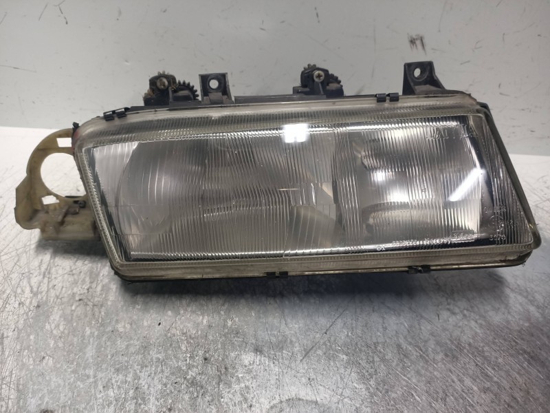 Recambio de faro derecho para lancia delta 1.4 cat referencia OEM IAM   